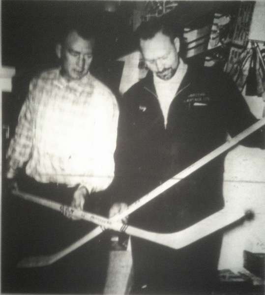 Roy Borstad, new manager of Grande Prairie Athletics, checks out equipment with coach Pete Wright. Submitted photo