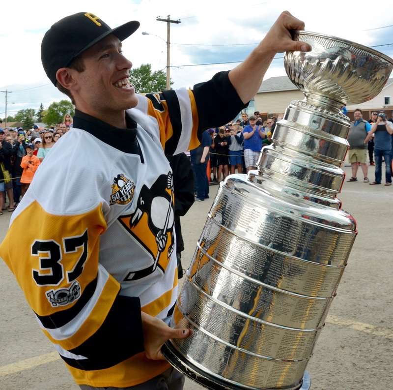 Carter Rowney shows off the cup. Photo by Stan Neufeld